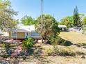 Aerial view of a charming single-story home featuring a well-maintained yard at 3823 N 56Th St, Tampa, FL 33619