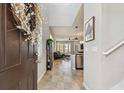 Inviting foyer showcasing an open floor plan, tile flooring, and a glimpse of the living spaces at 5276 6Th N Way, St Petersburg, FL 33703