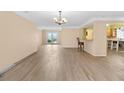 A spacious living room featuring new flooring, neutral walls, and an open floorplan at 543 Crystal Dr, Madeira Beach, FL 33708