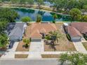 Beautiful home with an inviting backyard overlooking a serene lake, complete with a wooden deck at 709 47Th E St, Bradenton, FL 34208