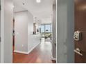 Modern condo hallway featuring sleek hardwood floors, contemporary lighting fixtures, and inviting open floor plan at 777 N Ashley Dr # 2603, Tampa, FL 33602