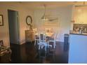 Cozy dining room features dark wood floors, and a modern light fixture at 1400 Gandy N Blvd # 708, St Petersburg, FL 33702