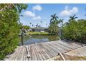 Picturesque backyard featuring a private dock and tranquil canal view at 1524 Carson Ne Cir, St Petersburg, FL 33703