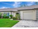Attractive single Gathering home with neat landscaping, two-car garage, and a well kept lawn at 18807 Tournament Trl, Tampa, FL 33647