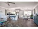 Bright living room with an open floorplan, kitchen, and dining area featuring sleek floors and modern finishes at 2400 62Nd N St, St Petersburg, FL 33710