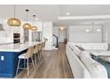 Open floor plan showcasing a modern kitchen with a large island, opening up to the living room at 2563 Ocean Breeze Ln, Clearwater, FL 33761
