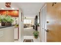 Inviting condo foyer with tile floors, coat closet, and a glimpse into the open living area beyond at 2595 Countryside Blvd # 8205, Clearwater, FL 33761
