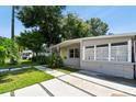 Well-maintained single story home with a lush lawn, walkway, and attractive landscaping at 3626 17Th N St, St Petersburg, FL 33713