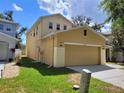 The house features a two-car garage and a well-maintained lawn, showing the property's side at 4633 White Bay Cir, Wesley Chapel, FL 33545