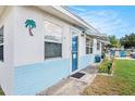 Close-up of the home's inviting entrance, showcasing unique exterior details and a well-kept walkway at 4707 Alma St, New Port Richey, FL 34652
