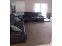 Spacious living room with comfortable seating and carpeted floors, perfect for relaxing at 5443 Tangerine Dr, New Port Richey, FL 34652