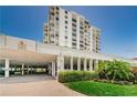Exterior of condo building featuring covered parking and lush landscaping at 6265 Sun Blvd # 805, St Petersburg, FL 33715