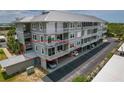 Beautiful exterior of the condo, showcasing the balcony and covered parking at 7 Island Park Pl # 204, Dunedin, FL 34698