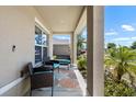 Inviting covered front porch with outdoor seating, perfect for relaxing and enjoying the view at 718 Tidal Rock Ave, Ruskin, FL 33570