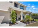 Charming front porch with seating area, providing a welcoming entrance to the home at 718 Tidal Rock Ave, Ruskin, FL 33570