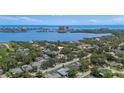 Breathtaking aerial view showcasing the home's proximity to the water and nearby city skyline at 7314 Hunt Club Ln, Seminole, FL 33776
