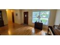 Inviting living room featuring hardwood floors and a large window providing natural light at 7336 20Th N St, St Petersburg, FL 33702