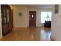 Spacious living room with hardwood floors, an area rug, and natural light from the window at 7336 20Th N St, St Petersburg, FL 33702