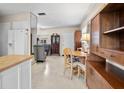 Spacious living area with seamless transition to the dining space and kitchen area, featuring an open layout at 12400 Park Blvd # 522, Seminole, FL 33772