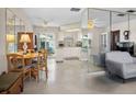 Open-concept living area with bright interior, seamlessly connecting the living room, dining area, and kitchen at 12400 Park Blvd # 522, Seminole, FL 33772