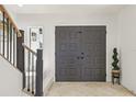 Elegant foyer features grand double doors, staircase, and tasteful décor, creating a welcoming ambiance at 1502 Creekbend Dr, Brandon, FL 33510