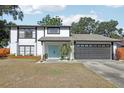 Charming two-story home showcasing a fresh exterior, well-maintained lawn, and inviting curb appeal at 1502 Creekbend Dr, Brandon, FL 33510