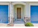Inviting front door with stone accents creating a welcoming entry to this home at 1510 Blue Sea St, Clearwater, FL 33756