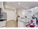 Modern kitchen with a granite countertops, stainless steel appliances and island seating at 1510 Blue Sea St, Clearwater, FL 33756