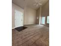 Neutral living room with carpet flooring, high ceilings, and lots of natural light at 1530 Villa Capri Cir # 302, Odessa, FL 33556