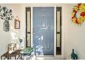 Welcoming front door with decorative floral accents and charming decor at 1823 Atrium Dr, Sun City Center, FL 33573
