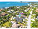 Gorgeous aerial view of a waterfront single-Gathering home with lush greenery and water views at 219 Miramar Ne Blvd, St Petersburg, FL 33704