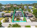 Expansive aerial view of a single-Gathering home with ocean view with well-maintained landscaping at 219 Miramar Ne Blvd, St Petersburg, FL 33704