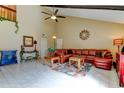 Comfortable living room with vaulted ceiling, fan, and ample seating at 2600 Forest Run Ct, Clearwater, FL 33761