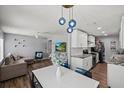 Well lit and open living space with eat-in kitchen and modern furniture at 4232 N Sandalwood Cir, Tampa, FL 33617