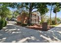 Side view showcasing the home's architectural design and expansive driveway at 4309 W Robin Ln, Tampa, FL 33609