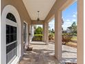 Spacious front porch featuring brick pavers, updated lighting, and neutral paint scheme at 4531 44Th S St, St Petersburg, FL 33711