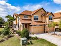 Charming two-story house with manicured lawn, and attached two car garage at 4730 Wandering Way, Wesley Chapel, FL 33544