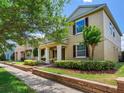 Attractive home featuring a welcoming front porch, neutral exterior, and tidy landscaping at 5409 Fishhawk Ridge Dr, Lithia, FL 33547