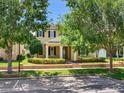 Beautiful two-story home with well-maintained front yard, brick accents, and lush landscaping at 5409 Fishhawk Ridge Dr, Lithia, FL 33547