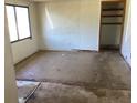 Empty living room with a window and an empty closet at 5700 65Th N Ave, Pinellas Park, FL 33781