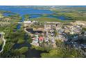 An aerial view highlights the property situated on a waterfront lot, close to the water at 6908 11Th E Ave, Palmetto, FL 34221