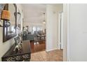 Inviting entryway leading into a living room with hardwood floors at 8728 Mcadam Pl, Tampa, FL 33634