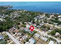 Aerial view showing the home's location near the water and the beautiful neighborhood at 1011 Coldstream Ct, Tarpon Springs, FL 34689