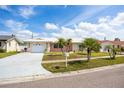 Charming single-story home with a well-maintained lawn and inviting curb appeal and driveway at 11225 59Th Ave, Seminole, FL 33772