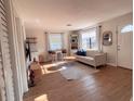 Inviting living room with wood flooring, modern decor, and ample natural light at 212 41St S St, St Petersburg, FL 33711