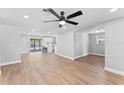 Spacious open floor plan featuring modern lighting and updated flooring throughout at 2214 Selkirk St, Valrico, FL 33594