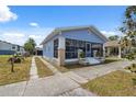 Charming single Gathering home featuring a screened-in front porch and long driveway at 2217 Stuart St, Tampa, FL 33605