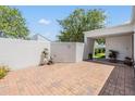 Private brick courtyard showcasing a well-maintained outdoor space with entrance to the home at 4002 Cypress Ct # 4002, Tampa, FL 33618