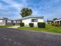 Charming single-story home with a covered carport and neat landscaping at 5150 Damsen Cir, New Port Richey, FL 34653