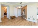 Bright entryway featuring wood floors, decor, and easy access to in-unit laundry at 5729 Puerta Del Sol S Blvd # 185, St Petersburg, FL 33715
